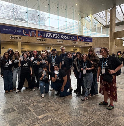 Michelle Flores with students at AWP 26 Conference